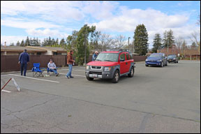 red SUV at finish